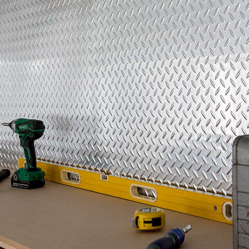 Garage with Fasade's Diamond Plate in Brushed Aluminum.
